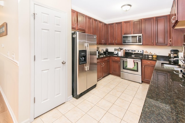 225 W Oakbrook Dr, Ann Arbor, MI 48103 - kitchen with stainless steel appliances, light tile patterned floors, dark stone countertops, and ornamental molding