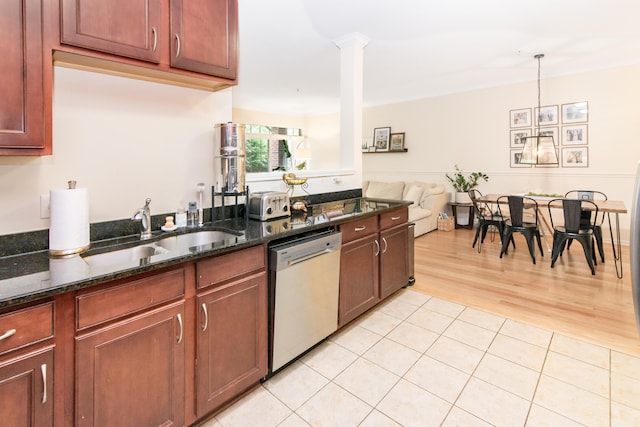 225 W Oakbrook Dr, Ann Arbor, MI 48103 - kitchen featuring dishwashing machine, dark stone counters, open floor plan, hanging light fixtures, and light wood-style floors