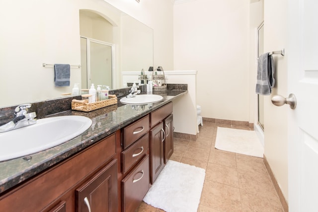 225 W Oakbrook Dr, Ann Arbor, MI 48103 - full bathroom with a shower stall, double vanity, and tile patterned flooring