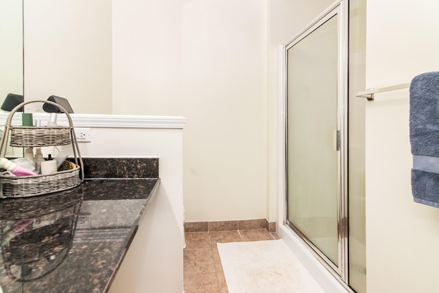 225 W Oakbrook Dr, Ann Arbor, MI 48103 - bathroom with a stall shower and tile patterned flooring