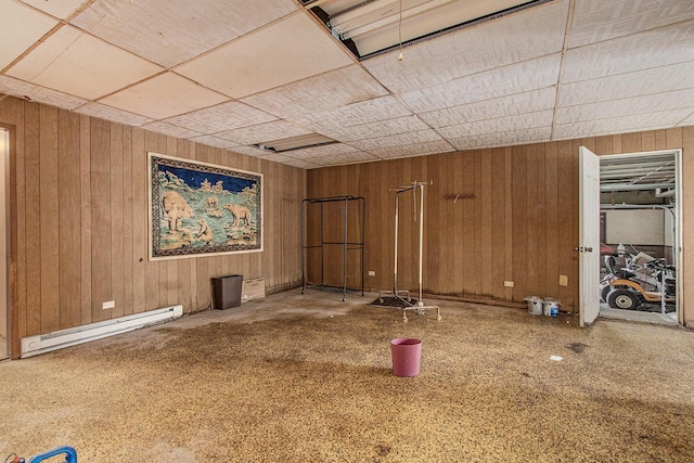 2597 E Glendora Rd, Buchanan, MI 49107 - below grade area with a baseboard heating unit and wooden walls
