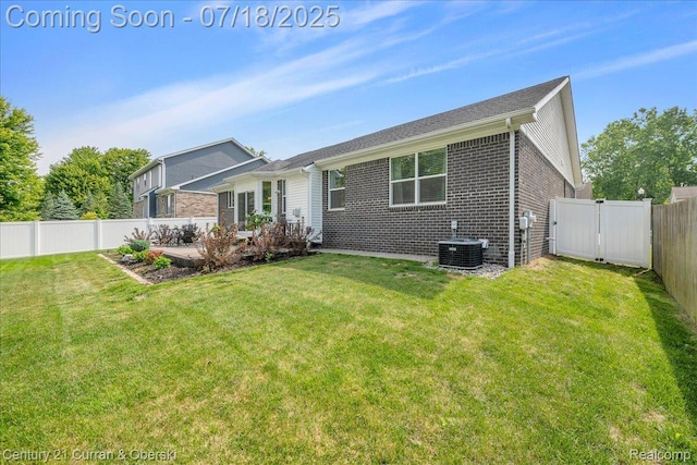 21150 Bryce Ct, Romulus, MI 48174 - rear view of property with brick siding, a fenced backyard, and a gate