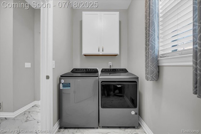 21150 Bryce Ct, Romulus, MI 48174 - laundry area with light marble finish flooring, cabinet space, and washer and dryer