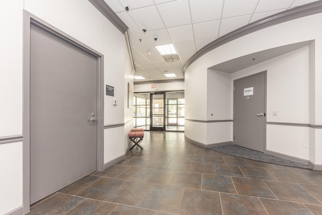 111 N Ashley St Unit 412, Ann Arbor, MI 48104 - hall featuring baseboards and a drop ceiling