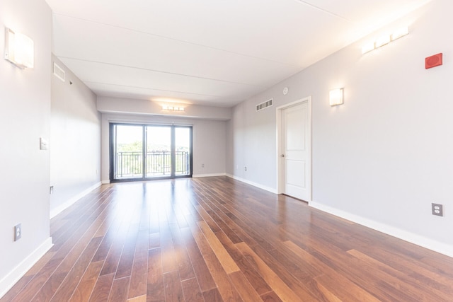 111 N Ashley St Unit 412, Ann Arbor, MI 48104 - unfurnished room featuring dark wood finished floors and baseboards