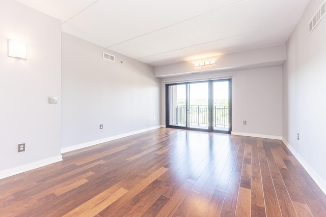 111 N Ashley St Unit 412, Ann Arbor, MI 48104 - spare room featuring dark wood-style floors and baseboards