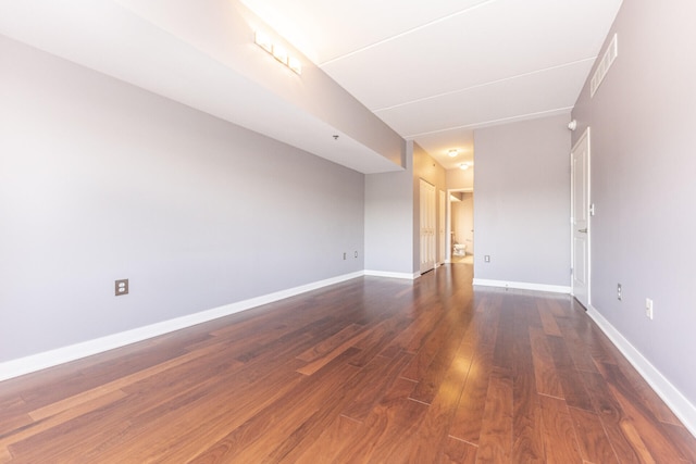 111 N Ashley St Unit 412, Ann Arbor, MI 48104 - empty room featuring dark wood-style floors and baseboards