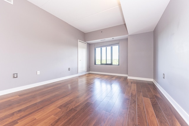 111 N Ashley St Unit 412, Ann Arbor, MI 48104 - empty room with dark wood finished floors and baseboards