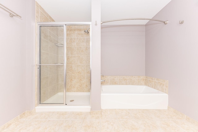 111 N Ashley St Unit 412, Ann Arbor, MI 48104 - bathroom featuring a shower stall, a garden tub, and tile patterned floors