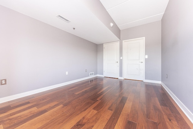 111 N Ashley St Unit 412, Ann Arbor, MI 48104 - unfurnished bedroom with dark wood-style floors and baseboards