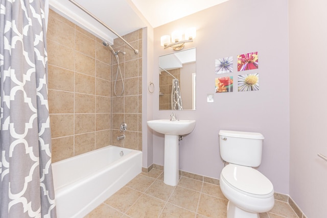 111 N Ashley St Unit 412, Ann Arbor, MI 48104 - bathroom with shower / bathtub combination with curtain and tile patterned flooring