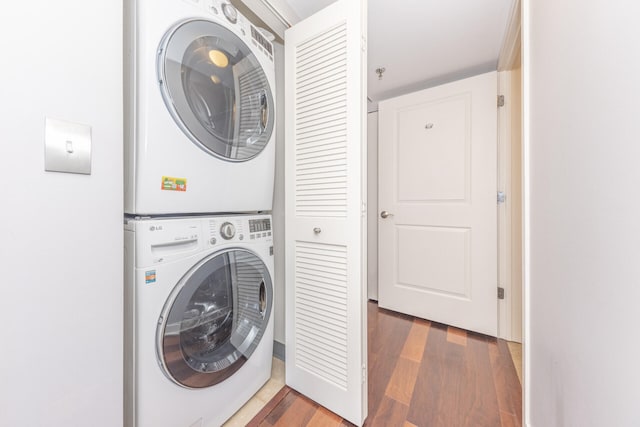 111 N Ashley St Unit 412, Ann Arbor, MI 48104 - washroom with stacked washer / dryer and wood finished floors