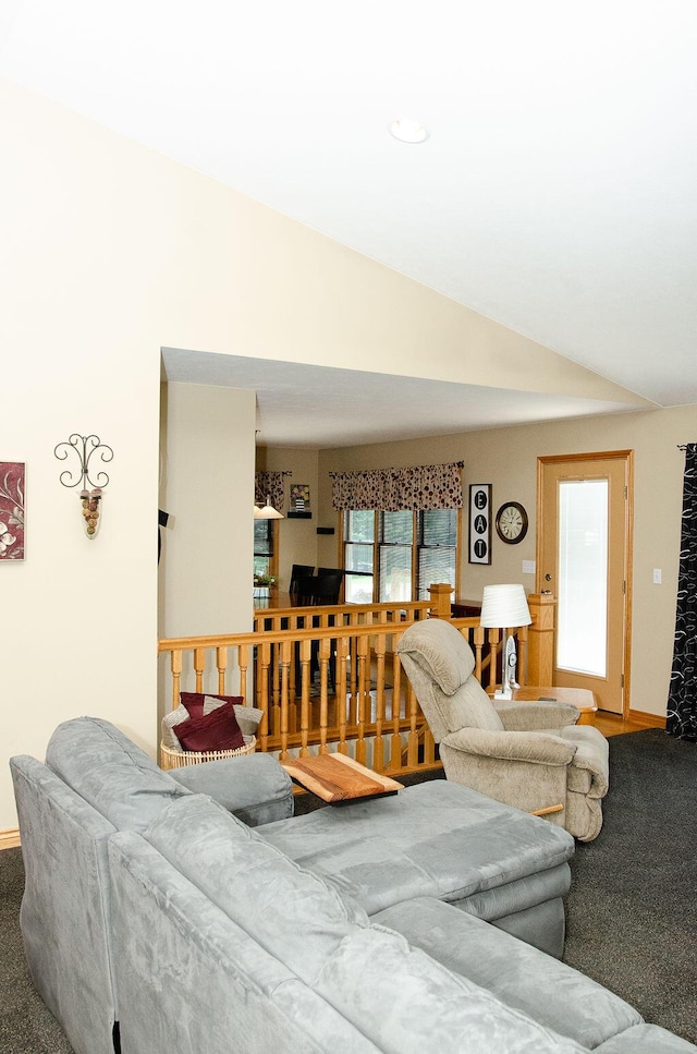 11734 Lindy Ct, Rockford, MI 49341 - carpeted living area with vaulted ceiling and baseboards