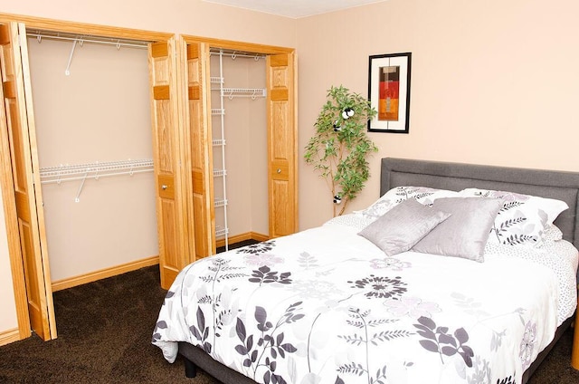 11734 Lindy Ct, Rockford, MI 49341 - carpeted bedroom with baseboards and multiple closets