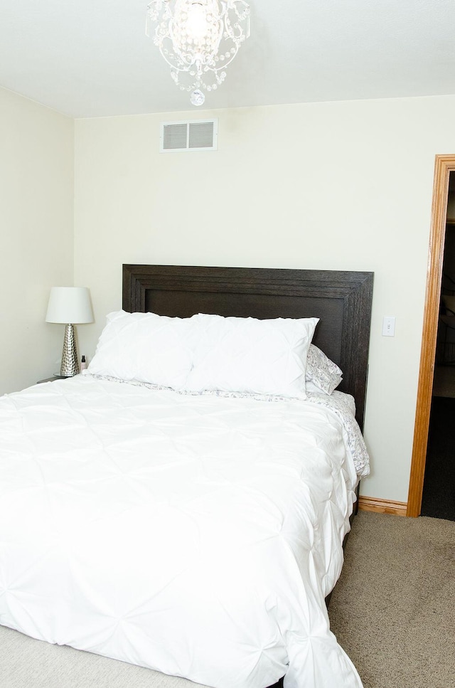 11734 Lindy Ct, Rockford, MI 49341 - bedroom with carpet floors and a chandelier