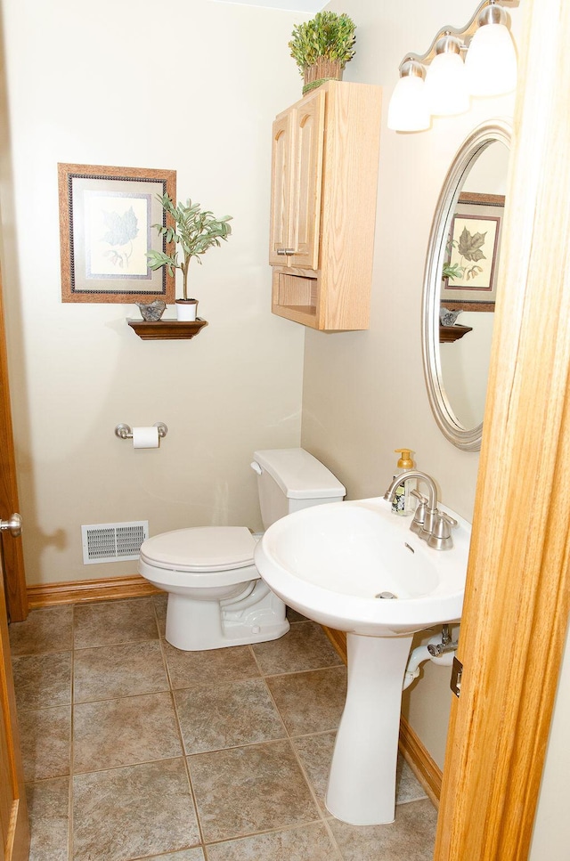 11734 Lindy Ct, Rockford, MI 49341 - half bathroom with toilet and baseboards