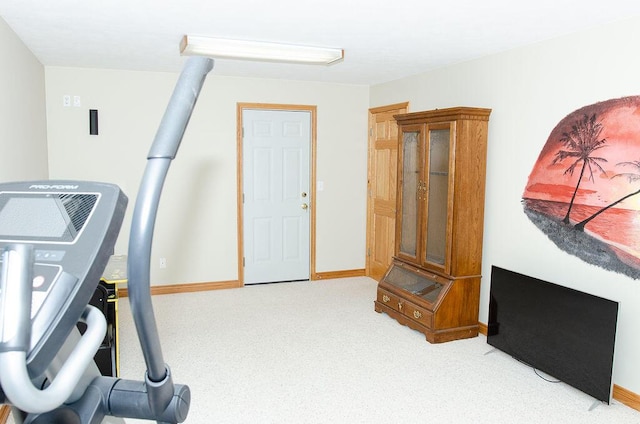11734 Lindy Ct, Rockford, MI 49341 - workout room featuring carpet floors and baseboards