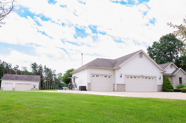 11734 Lindy Ct, Rockford, MI 49341 - view of home's exterior with a lawn, a garage, concrete driveway, and brick siding