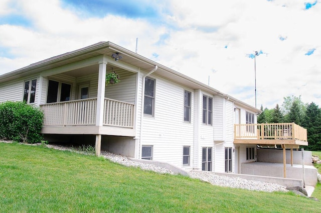 11734 Lindy Ct, Rockford, MI 49341 - view of side of property featuring a yard and a wooden deck