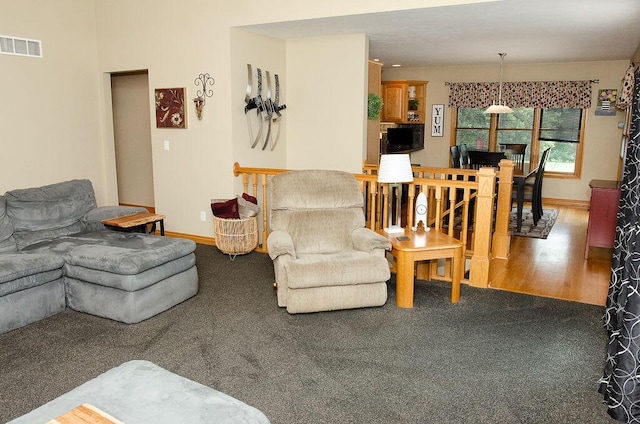 11734 Lindy Ct, Rockford, MI 49341 - living area with carpet floors and wood finished floors