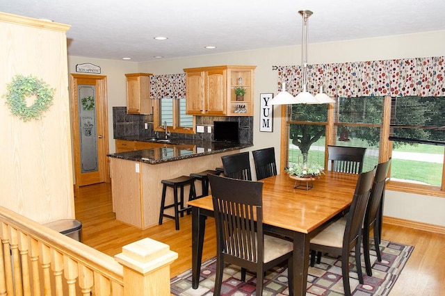 11734 Lindy Ct, Rockford, MI 49341 - dining space with light wood-style floors and recessed lighting