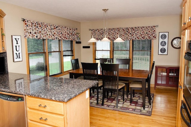 11734 Lindy Ct, Rockford, MI 49341 - dining area with light wood-style floors