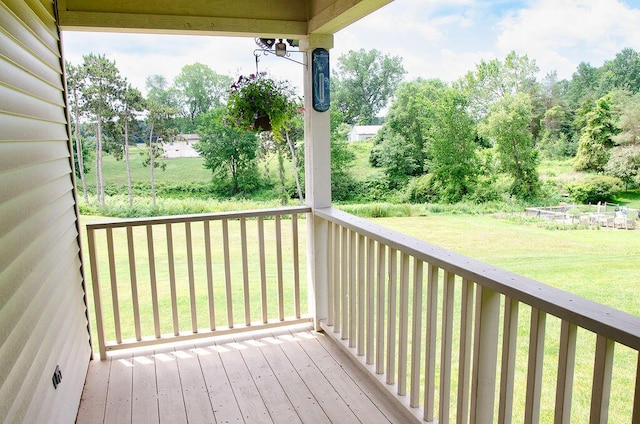 11734 Lindy Ct, Rockford, MI 49341 - wooden terrace with a yard and view of scattered trees