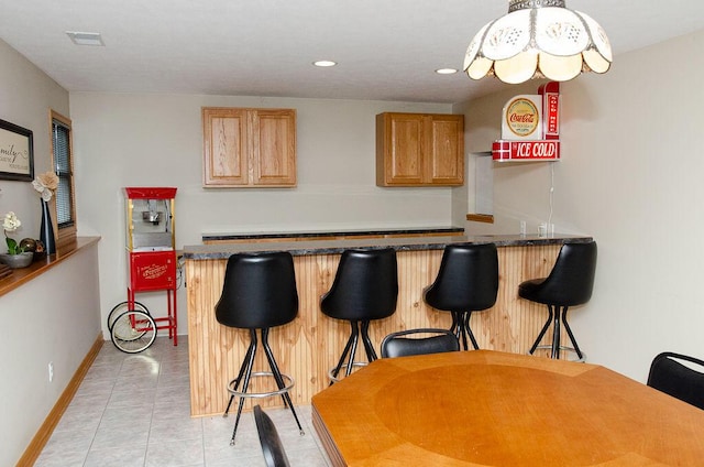 11734 Lindy Ct, Rockford, MI 49341 - indoor dry bar featuring light tile patterned flooring and recessed lighting