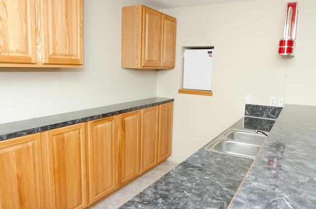 11734 Lindy Ct, Rockford, MI 49341 - kitchen with a sink and light tile patterned floors