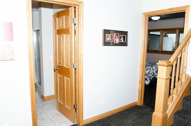 11734 Lindy Ct, Rockford, MI 49341 - hallway featuring stairway and light tile patterned flooring