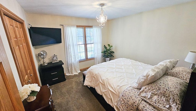 11734 Lindy Ct, Rockford, MI 49341 - bedroom featuring dark carpet and a chandelier