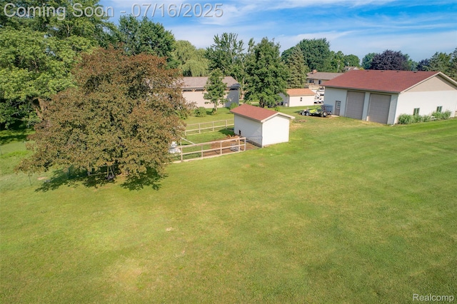 7366 E Maple Ave, Grand Blanc, MI 48439 - view of yard with an outdoor structure and a garage