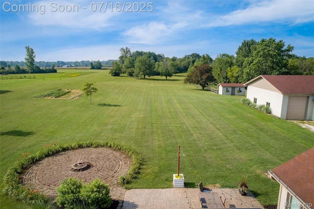7366 E Maple Ave, Grand Blanc, MI 48439 - view of green lawn featuring an outdoor fire pit