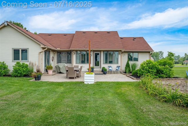 7366 E Maple Ave, Grand Blanc, MI 48439 - rear view of property with a patio, a shingled roof, and a yard
