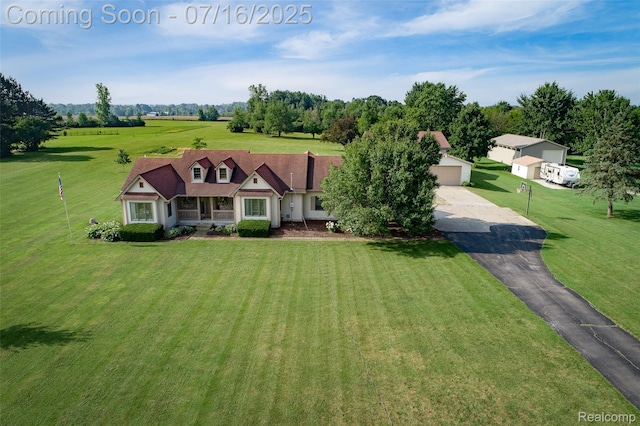 7366 E Maple Ave, Grand Blanc, MI 48439 - new england style home with a garage, driveway, and a front yard