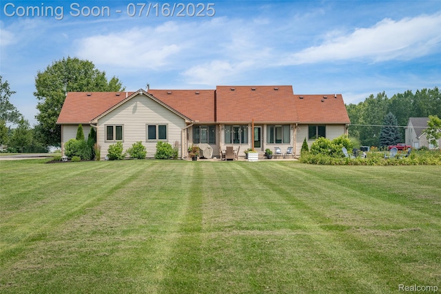 7366 E Maple Ave, Grand Blanc, MI 48439 - rear view of house featuring a lawn