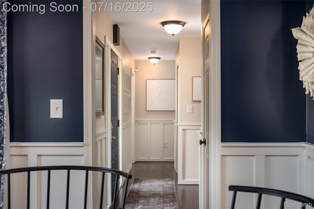 7366 E Maple Ave, Grand Blanc, MI 48439 - hall with a decorative wall, wainscoting, and dark wood finished floors