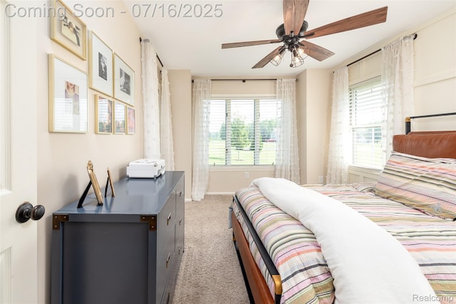 7366 E Maple Ave, Grand Blanc, MI 48439 - bedroom with multiple windows, light colored carpet, and a ceiling fan