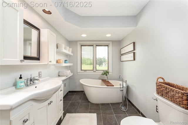 7366 E Maple Ave, Grand Blanc, MI 48439 - bathroom with vanity, a freestanding tub, tile patterned floors, and recessed lighting