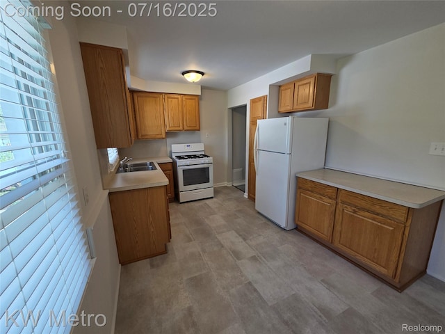 4507 Sedgemoor Ave, Royal Oak, MI 48073 - kitchen with white appliances, brown cabinets, and light countertops