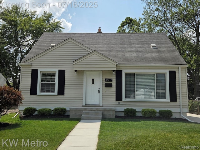 4507 Sedgemoor Ave, Royal Oak, MI 48073 - cape cod house featuring roof with shingles and a front yard
