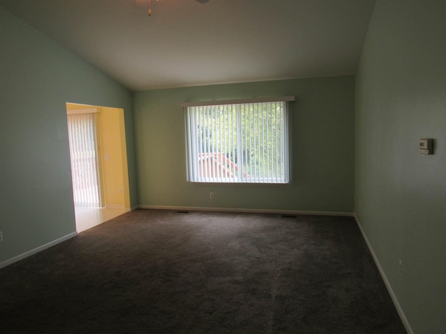 4237 W Grand Blanc Rd, Swartz Creek, MI 48473 - carpeted spare room with vaulted ceiling and ceiling fan