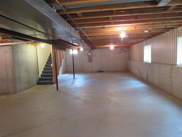 4237 W Grand Blanc Rd, Swartz Creek, MI 48473 - basement featuring stairway and brick wall
