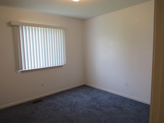 4237 W Grand Blanc Rd, Swartz Creek, MI 48473 - carpeted empty room with baseboards