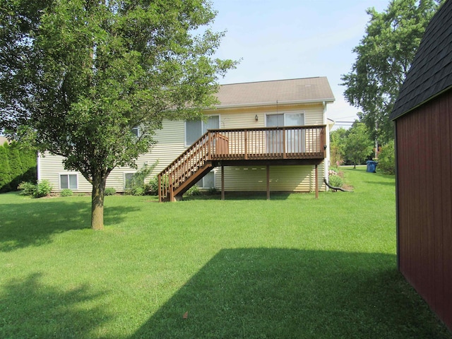 4237 W Grand Blanc Rd, Swartz Creek, MI 48473 - rear view of house featuring stairs, a wooden deck, and a lawn