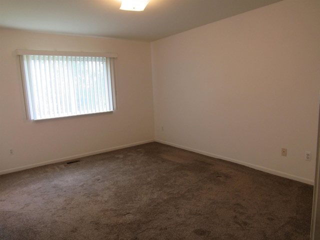 4237 W Grand Blanc Rd, Swartz Creek, MI 48473 - carpeted spare room featuring baseboards