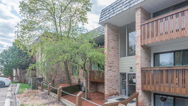 2124 Pauline Blvd Unit 206, Ann Arbor, MI 48103 - view of side of property featuring brick siding and mansard roof