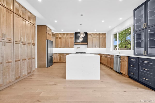 227 W Houstonia Ave, Royal Oak, MI 48073 - kitchen with appliances with stainless steel finishes, a center island, recessed lighting, light wood-style floors, and light countertops