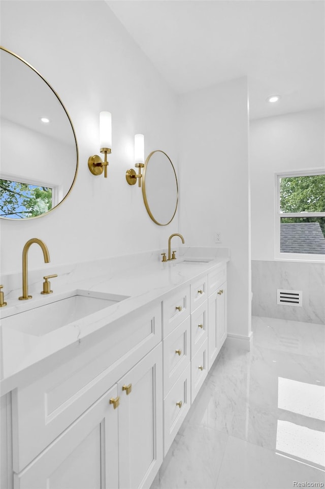 227 W Houstonia Ave, Royal Oak, MI 48073 - bathroom featuring double vanity, marble finish floors, and recessed lighting