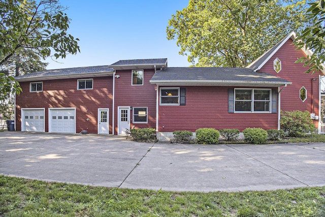 220 Park Ave, South Haven, MI 49090 - view of front facade with an attached garage and concrete driveway